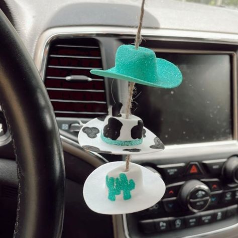 PRICES MAY VARY. ✨Cowboy Hat Car Charm -- Looking for simple yet unique Western accessories for your vehicle? My handmade cowboy hat car charm is a great way to do just that! ✨Cowboy Hat Car Charm -- This hand-assembled mini cowboy hat is the perfect addition to decorate your vehicle! It can be easily hung anywhere, adding a playful and charming element to your car. ✨Cowboy Hat Car Charm -- They're so lightweight, just strap them to your rearview mirror and your car's charm is ready to shine! ✨C Cowboy Hat Print, Mini Cowboy, Mini Cowboy Hat, Car Mirror Decorations, Car Hanging Accessories, Beaded Decor, Rearview Mirror Decoration, Easy Homemade Gifts, Mirror Pendant