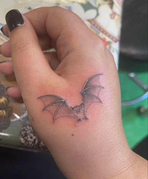 Matching bat tattoo with Kelly and Ozzy Osbourne done by Shamrock Social Club Black Cat Bat Tattoo, Vampire Tattoo Stencil, Bat Tattoo Aesthetic, Ozzy Bat Tattoo, Ozzy Osbourne Bat Tattoo, Wrist Bat Tattoo, Small Bat Tattoo Design, Hand Bat Tattoo, Bat Tattoo On Hand