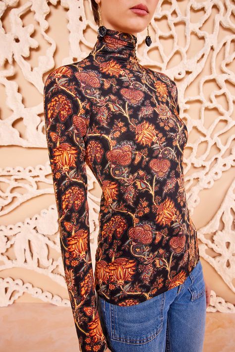 Our Aurelia Turtleneck in lightweight tricot jersey is a forever favorite silhouette, printed in a mesmeric blend of paisley botanicals inspired by vintage French florals. Blooming with orange and red hues against classic black, this long-sleeve top has a close fit that makes it perfect for layering or wearing on its own, while the high neck adds a touch of elegance. Composition: 91% Rayon, 9% Elastane Nyc Boutiques, Brown Long Sleeve, Long Sleeve Floral Top, Knit Denim, Turtleneck Top, Denim Accessories, Knitted Coat, Signature Print, Turtle Neck Top