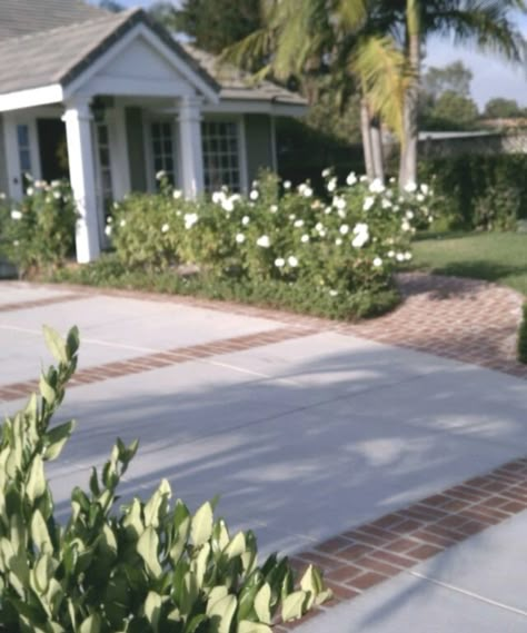 Brick Stamped Concrete Driveway, Driveway With Brick Accent, Driveway Cement Designs, Brick Border Driveway, Concrete Driveway With Brick Inlay, Brick Parking Pad, Concrete Driveway With Brick Border, Brick Lined Driveway, Brick And Concrete Driveway