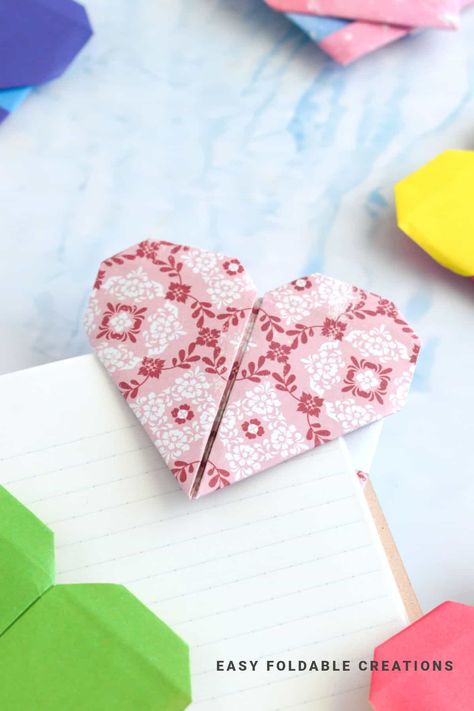 Heart Origami Bookmark | Easy Foldable Creations Foldable Bookmarks, Envelope Diy Paper, Origami Box With Lid, Origami Heart With Wings, Bookmark Easy, Christmas Tree Napkin Fold, Origami Bookmarks, Santa Gift Tags, Christmas Tree Napkins