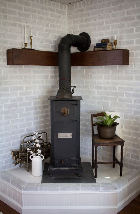 Corner Hearth Makeover Brick Wood Stove Hearth, Pellet Stove Ideas Corner, Stove Makeover, Hearth Makeover, Corner Hearth, Pellet Stove Hearth, Wood Stove Decor, Wood Burning Stove Corner, Corner Wood Stove