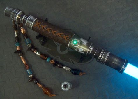 A'Sharad Hett lightsaber Lightsaber Hilt Design, Double Sided Lightsaber, Double Bladed Lightsaber, Wood Lightsaber Hilt, Ancient Lightsaber, Curved Lightsaber Hilt, Long Handled Lightsaber, Blue Lightsaber, Diy Lightsaber