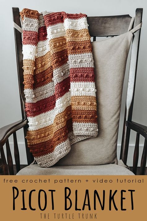 Striped, crochet blanket laying on a rocking chair. Crochet pattern is the Picot Blanket by The Turtle Trunk. Big Yarn Crochet Blanket, 1 Stitch Crochet Blanket, Starter Crochet Patterns, Crochet Blanket 3 Colors, Crochet Patterns For Beginners Step By Step, Multicolor Crochet Blanket, Picot Blanket, Lightweight Crochet Blanket, Crochet Blanket Patterns Unique