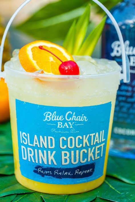 Coconut meets it match. This signature Blue Chair Bay Rum cocktail recipe is the perfect easy summer drink. Its simple and fruity. Build ingredients directly into tall glass with ice. Stir and flirt. Want produce? Add an orange slice and cherry. #bluechairbay #coconutrum #BCBHappyHour Bucket Cocktail Recipes, Summer Bucket Drinks Alcohol, Drink Bucket Recipes, Malibu Rum Bucket Recipe, Rum Buckets Recipe, Alcohol Bucket Drinks, Bucket Drinks Alcohol Party Ideas, Sand Bucket Alcohol Drink, Rum Bucket Recipe