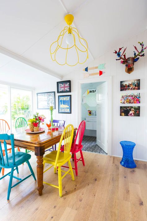 A Brisbane couple transform a character-filled Queenslander-style cottage, which was in desperate need of an renovation. Take a look inside! Dining Table With Different Color Chairs, Colorful Dining Room Chairs, Colorful Kitchen Tables, Reapolstering Chairs, Cozy College Dorm, Painting Kitchen Chairs, Colored Dining Chairs, Traditional Dining Chairs, Woven Dining Chairs