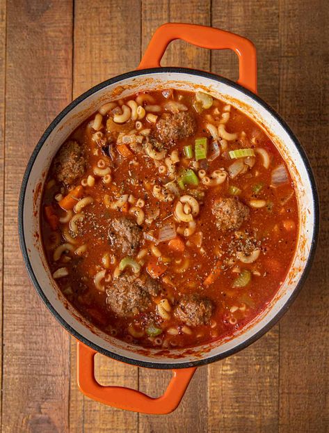 Meatball Soup is an easy and hearty weeknight meal with homemade meatballs, elbow macaroni, tomato soup, parmesan cheese, and Italian seasoning. #dinner #soup #meatballs #italianfood #meatballsoup #dinnerthendessert Macaroni Tomato Soup, Soup Parmesan, Meatballs Soup, Meatball Soup Recipes, Dinner Soup, Macaroni Soup, Meatball Recipes Easy, Slow Cooker Meatballs, Meatball Soup