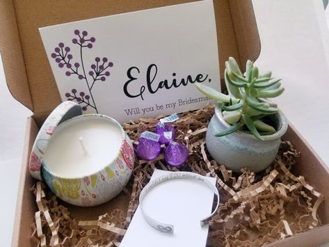 Personalized Bridesmaid proposal gift set, will you be my bridesmaid, live succulent, maid of honor proposal, asking bridesmaid gift box.➤➤➤ Gift box include:✔ 1 live succulent (in a beautiful 2.5 inches ceramic flowing glaze pot in light gray).✔ 1 scented candle made from natural soy wax in a portable travel tin. ECO-FRIENDLY 100% SOY - These candles are made with naturally biodegradable and eco-friendly pure soy wax.4.4 oz & burns for a 20-25 hours. Size: Diameter 2" x 3 HScent and color m Taking Care Of Succulents, Maid Of Honor Proposal, Asking Bridesmaids, Bridesmaid Gift Boxes, Be My Bridesmaid Cards, Bridesmaid Proposal Gifts, Bridesmaid Cards, Bridesmaids Personalized, Proposal Gifts