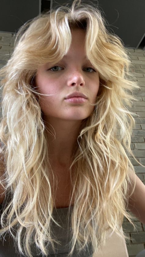 1990 Haircut, Blonde Hair Choppy Layers, Blonde Curly Shag With Bangs, Long Wolf Cut With Bangs Wavy Hair, Blonde Feathered Bangs, Blonde Rocker Messy Fringe, Long Wolf Cut Wavy/curly Hair, Wolfcut Hair Long, Cowgirl Hair