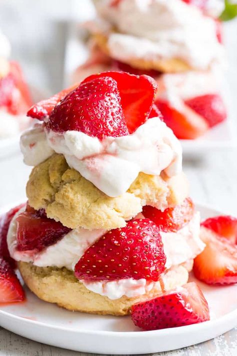 Classic strawberry shortcake is made gluten-free, dairy-free, and paleo yet it's every bit as delicious as the original!  Grain free Paleo biscuits are filled with lightly sweetened strawberries and an easy coconut whipped cream for a fun anytime dessert that everyone will love. Vegan Shortcake, Paleo Biscuits, Vegan Strawberry Shortcake, Memorial Day Desserts, Bbq Desserts, Sweet Whipped Cream, Strawberry Shortcakes, Strawberry Shortcake Recipes, Shortcake Recipe