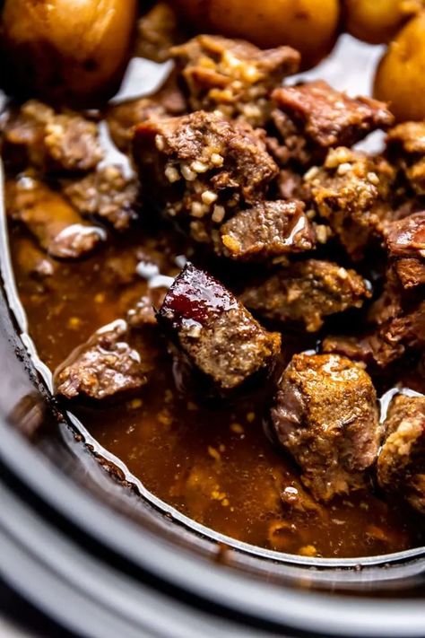 A close-up photo of garlic butter beef bites in a slow cooker. Garlic Butter Stew Meat, Slow Cooker Garlic Butter Beef Bites And Potatoes, Garlic Butter Steak Bites Crockpot, Garlic Butter Beef Bites, Slow Cooker Beef Tenderloin, Beef Bites, Butter Beef, Crock Pot Beef Tips, Asian Steak Bites