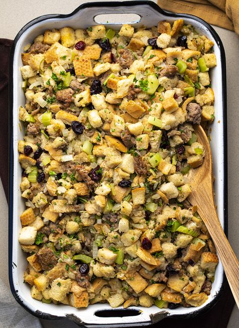 Sausage Stuffing in a Pan with Wooden Spoon Stuffing With Apples And Cranberries, Sausage Apple Cranberry Stuffing, Apple Cranberry Stuffing, Stuffing With Sausage, Cranberry Stuffing, Stuffing Thanksgiving, Sausage Stuffing Recipe, Dressing Recipes Thanksgiving, Sage Stuffing