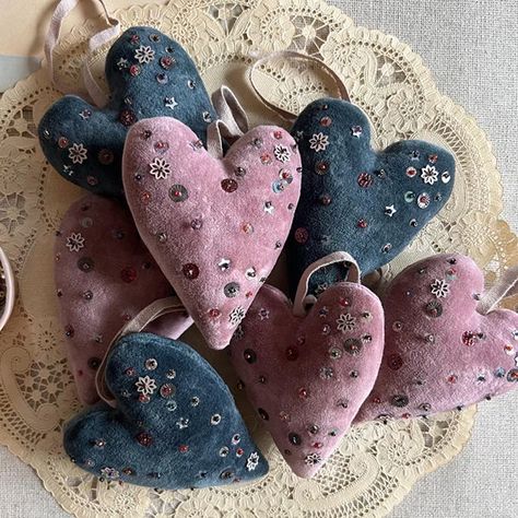 Lovely vintage inspired velvet hearts decorated with various sparkling sequins.  Sold individually. Available in Indigo + dusty pink.  Approximately 4" tall with twill tape loop.  A thoughtful gift for any time of year.Perfect for gift toppers, closet or drawer sachets, holiday ornaments or year round décor. *This orn Velvet Heart Ornament, Christmas Fabric Ornaments Diy, Fabric Hearts How To Make, Skippy Cotton, Valentine Ornaments, Velvet Hearts, Kids Sketchbook, Drawer Sachets, Patchwork Heart