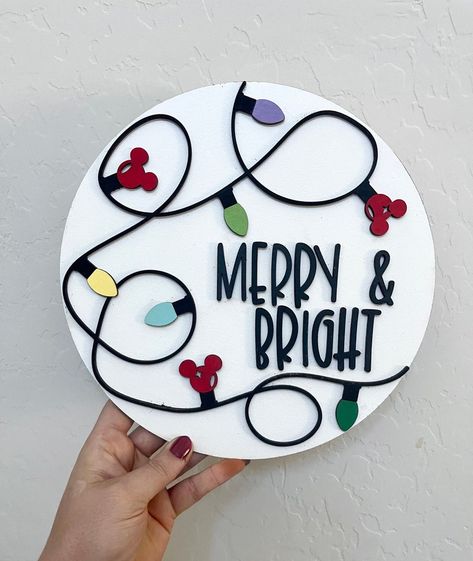 Disney Christmas Signs Wooden, Diy Christmas Disney Decorations, Disney Holiday Crafts, Disney Christmas Signs Diy, Disney Christmas Door Hanger, Painted Disney Ornaments, Disney Christmas Cricut Projects, Disney Christmas Stockings Diy, Disney Inspired Christmas Decorations