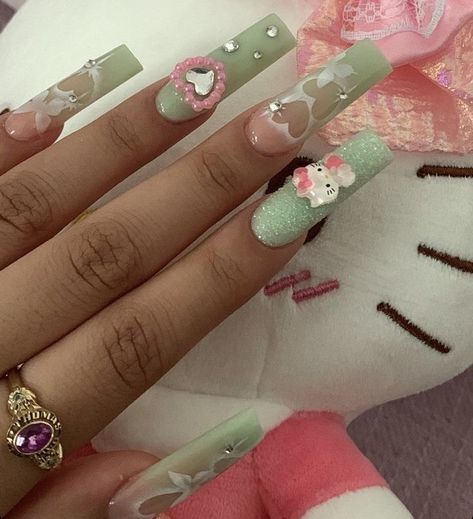 Medium Nails Acrylic Charms, Green Hello Kitty Nails, Y2k Nails Hello Kitty, Long Nails With Charms, Acrylic Nails Hello Kitty, Sanrio Acrylic Nails, Nail Ideas Y2k Long, Pink Kawaii Nails, Angel Number Nails