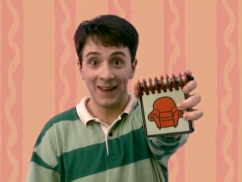 Steve is holding up his handy dandy notebook for Blue's clues. Guy From Blues Clues, Steve From Blues Clues, Blues Clues Notebook, Blues Clues Handy Dandy Notebook, Blues Clues Steve, Steve Blues Clues, Steve Burns, Handy Dandy Notebook, Pony Videos