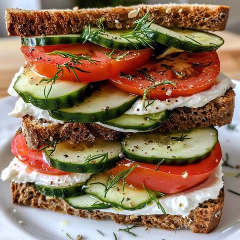 🥒🍅 A refreshing, crisp sandwich packed with flavor! #CucumberTomatoSandwich #FreshBites 🍽️ Cucumber Tomato Sandwich 🛒 Ingredients: 4 slices whole-grain bread 1 cucumber, sliced 2 tomatoes, sliced 1/4 cup cream cheese 1 tbsp fresh dill, chopped Salt & pepper to taste 👩‍🍳 Instructions: Prepare Spread: In a bowl, mix cream cheese, dill, salt, and pepper. Assemble Sandwiches: Spread cream cheese mixture on each slice of bread. Layer cucumber and tomato slices. Serve & Enjoy: Cut sandwiches in... Crisp Sandwich, Dill Salt, Cucumber And Tomato, Avocado Sandwich, Instagram Recipes, Grain Bread, Twisted Recipes, Sandwich Ingredients, Sandwich Spread