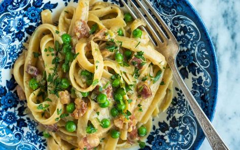 Stanley Tucci Shares His Recipe for Nico's Pasta With Prosciutto, Onions, Peas and Pancetta | Parade: Entertainment, Recipes, Health, Life, Holidays Stanley Tucci Pasta, Pasta With Prosciutto, Italian Bacon, Peas And Pancetta, Stanley Tucci Recipes, Tucci Recipes, Prosciutto Pasta, Pancetta Recipes, Creamy Pasta Recipes