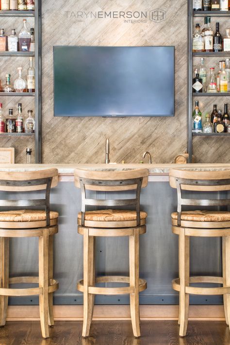 Gorgeous bar with farmhouse style sink and bar stools, angled wall shiplap with TV monitor for catching your favorite sports. Designed by Taryn Emerson, Lake Oswego, OR #mancave #homebars #farmhousesink #shiplap #lakeoswegointeriordesign #tarynemersoninteriors Tv Wall Bar Design, Basement Bar Tv Wall, Bar Design With Tv, Tv Over Bar, Bar Ideas For Home With Tv, Bar Wall With Tv, Tv Behind Bar, Bar With Shiplap Wall, Bar With Tv In Middle