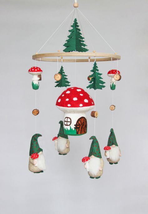 Baby mobile woodland willl be great for a baby shower or new baby gift. Mobile baby with gnomes and mushrooms  is a wonderful decor whether it is for a baby boy, baby girl or gender neutral nursery. This unique nursery mobile will bring the smile to your baby every moment! ▪️ MATERIALS: the round wooden hanger, felt, hypoallergenic holofiber filler. ▪️ MEASUREMENTS: The diameter of the ring is 23 cm.( 9,06 inches). Full length is about 50 cm ( 19.7 inches). ▪️ CUSTOM ORDERS: The parts could be changed and a completely new one can be added. If you would like this mobile made in a different color scheme let me know and I will put together the perfect mobile for your baby. ▪️ HOW TO CARE: For felt toys, I recommend using a sticky roller for clothes. If the toy is very dirty, you can wipe it w Gnome Nursery Theme, Gnome Nursery, Gnomes And Mushrooms, Forest Baby Nursery, Mushroom Nursery, Cottagecore Baby, Mobile Ideas, Neutral Crib, Woodland Mobile