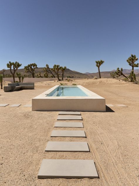 Photo 2 of 10 in This Desert Retreat Finds Harmony With Its Striking Natural Surroundings - Dwell Tiny Home Studio, Desert Retreat, Room Focal Point, Concrete Bench, Yucca Valley, Stucco Exterior, Desert Homes, Bench Designs, Ranch Style Home