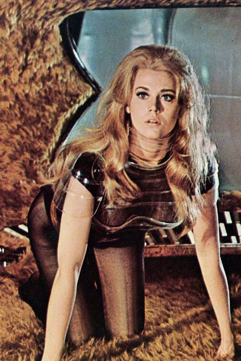 🚀✨ Dive into the world of Barbarella! 🌟 A dazzling mix of retro-futurism, sexy adventures, and cosmic wonder! 🌌💃 From iconic comics to the unforgettable movie starring the gorgeous Jane Fonda 💥, Barbarella embodies boldness, beauty, and endless exploration 🌠. A timeless symbol of fearless femininity and sci-fi glam 💋👠. Embrace the allure, the adventure, and the nostalgia! 🌟🚀 #Barbarella #RetroFuturism #SciFiGoddess #VintageVibes Barbarella Comic, Jane Fonda Barbarella, Scantily Clad, Across The Universe, Jane Fonda, Retro Futurism, Bold Fashion, Movie Stars, Pop Culture