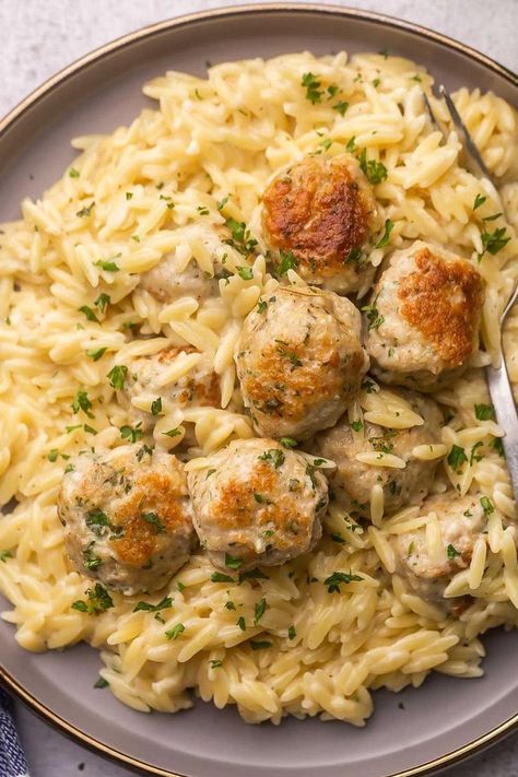 "An enticing image featuring Chicken Meatballs served on a bed of creamy Garlic Parmesan Orzo, a flavorful and comforting dish." Crockpot Garlic Butter Chicken Meatballs With Orzo, Chicken Meatballs And Risotto, Chicken Meatball Gnocchi, Instant Pot Chicken Meatballs, What To Make With Chicken Meatballs, Store Bought Meals, Healthy Meatball Dinner, Grilled Chicken Orzo, Chicken Meatball Casserole