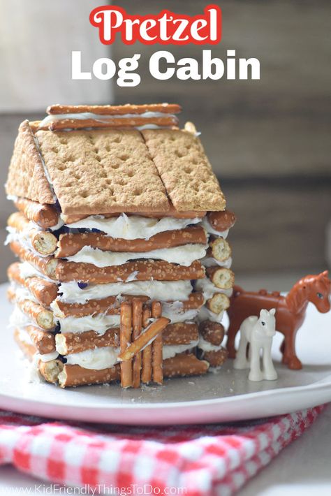 Pretzel Log Cabin, Pretzel Gingerbread House, Log Cabin Craft, Pioneer Activities, Graham Cracker House, Graham Cracker Gingerbread House, Cracker House, Log Cabin Christmas, Cabin Crafts