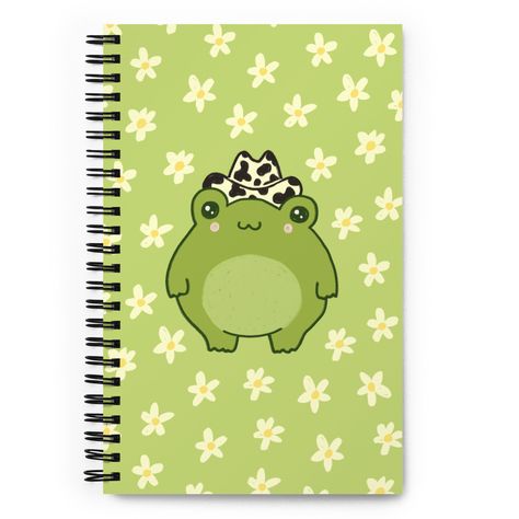 A good notebook can help you with motivation to take more notes, write down ideas, or list future dreams. This custom wire-bound notebook will be a great daily companion whenever you need to put your thoughts down on paper! * Covers with soft-touch coating * Cover weight: 10.38 oz/yd² (352 g/m²) * Page weight: 2.62 oz/yd² (89 g/m²) * Metal wire-o binding * 140 dotted pages * Size: 5.25″ × 8.25″ (13 × 21 cm) * Blank product sourced from the US 🐸 Message me if you want my designs on a different p Frog Cowboy Hat, Toad Aesthetic, Kawaii Cottagecore, Frog Wallpaper, Frog Decor, Frog Gifts, Future Dreams, Chapeau Cowboy, Stationary School