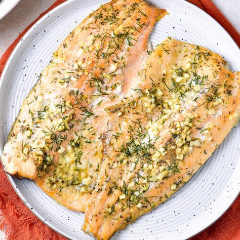 Baked Rainbow Trout With Garlic Butter - Cooked & Loved Baked Rainbow Trout Recipe, Trout Recipes Baked, Rainbow Trout Recipe Baked, Steel Head Trout Recipes, Baked Rainbow Trout, Trout Fillet Recipes, Rainbow Trout Recipe, Baked Trout, Trout Recipe