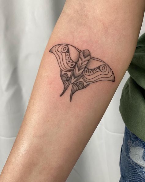 Black fine line moth tattoo on a woman’s upper forearm Tlou Moth, Moth Tattoo On Arm, The Last Of Us Moth, Mule Tattoo, Tattoos Moth, Tattoos On Arm, Luna Moth Tattoo, Moth Tattoos, Moth Tattoo