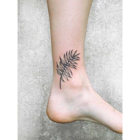 Little palm leaf tattoo by Zaya Hastra inked on the left inner ankle Palm Plant Tattoo, Palm Frond Tattoos, Leaf Tattoo Behind Ear, Palm Tree Leaf Tattoo, Palm Branch Tattoo, Palm Leaf Tattoo, Palm Tattoo, Related Tattoos, Filler Tattoo