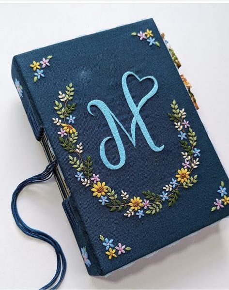 For anyone interested in owning a piece of this magic, making an order today is the first step. A new chapter awaits with these exquisite, hand-embroidered journals. Dairy Cover Design Ideas, Dairy Cover Design Diy, Diary Cover Design, Fashion Illustration Collage, Book Cover Diy, Hand Sewing Projects, Hand Embroidery Patterns Flowers, Framed Embroidery, Fabric Journals