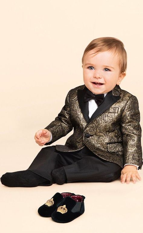 Cutie! Love this Dolce & Gabbana Baby Boys Gold Jacquard Blazer.  Perfect for a special occasion, this handsome baby blazer is made in a luxurious, metallic gold and black threaded jacquard cloth, by Italian brand Dolce & Gabbana. Makes a perfect ring bearer or pageboy outfit for baby boys at a Wedding! #dolcegabbana #babyboy #ringbearer #babyclothes #celebritybaby Pageboy Outfits, Boys Formal Wear, Kids Blazers, Colourful Prints, Tuxedo Mask, Blazer For Boys, Baby Boy Dress, Designer Baby Clothes