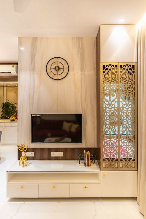 Home Weaving a Notion of Retreating to the Lap of Luxury | The ROUGE Wall - The Architects Diary To Unit Wall, Temple Living Room, Pooja In Living Room, Tv And Mandir Unit, Mandir In Tv Unit, Hidden Mandir In Living Room, Tv Wall With Mandir, Temple Unit, Tv Unit Decor With Mandir