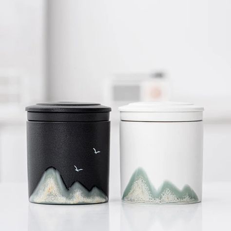 Elevate your tea drinking experience with our Handpainted Mountain travel mug. Crafted with handpainted ceramic and equipped with a strainer, this travel mug is perfect for on-the-go tea lovers. Each mug comes with its own travel bag, making it easy to take your favorite tea with you wherever you go. Adventure awaits! Decaf Green Tea, Mountain Mug, Raku Ware, Sencha Tea, Lover Birthday, Zen Tea, Coffee Container, Sugar Canister, Mountain Design