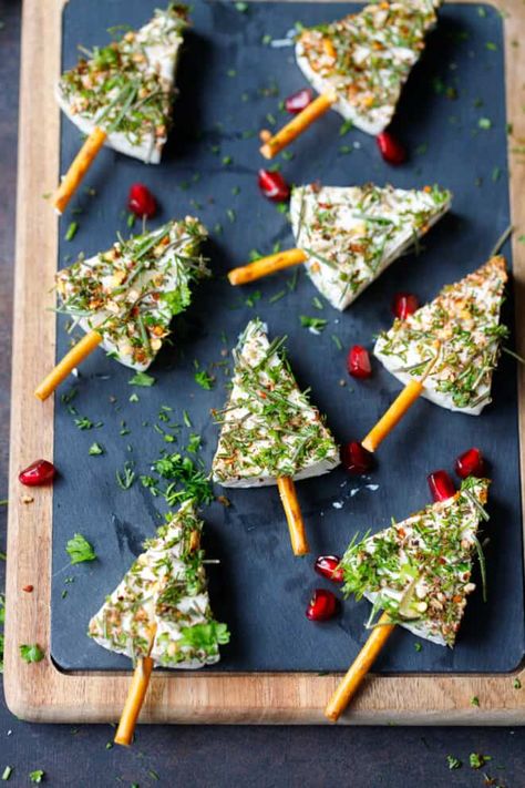 Cheese Wedge Christmas Trees - an appetizer, that is not only visually appealing but also provides a tasty combination of cheese, pretzels, and fresh herbs. Cheese Trees Snack, Christmas Tree Cheese Wedge, Christmas Cheese Trees, Cheese Tree Christmas, Ham And Cheese Christmas Tree Skewers, Cheese Wedge Christmas Trees, Cheese Tree Appetizer, Cheese Christmas Tree Appetizers, Christmas Tree Cheese Wedges