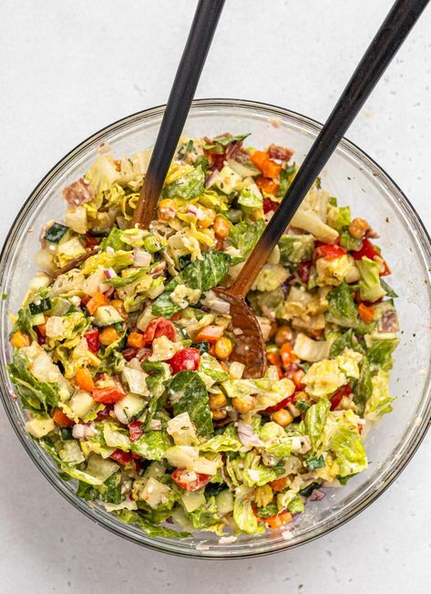 A large glass mixing bowl full of chopped salad. Chopped Salad Recipe, Tahini Dressing Recipe, Chopped Salad Recipes, Salad With Lemon, Lemon Tahini Dressing, French Fried Onions, Tahini Dressing, Chopped Salad, Fried Onions