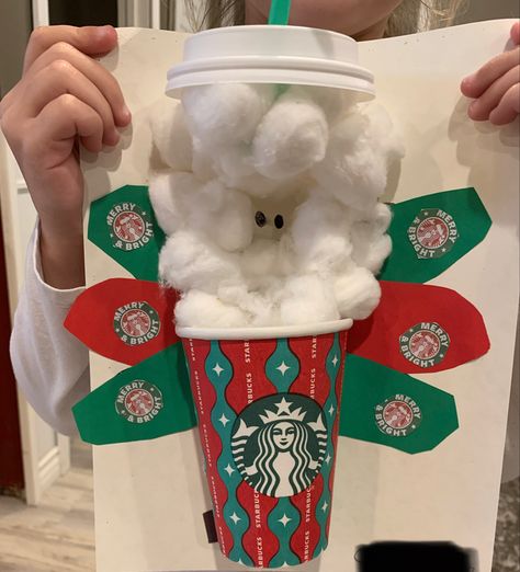 Starbucks holiday cup cut in half with cotton balls coming out of the top to represent whip cream. The lid is attached and has a green straw coming out of it. The turkey has red and green feathers with the holiday Starbucks logo on them. Turkey In Disguise Starbucks, Starbucks Turkey Disguise, Disguise A Turkey Starbucks, Disguise A Turkey Ideas Kids, Turkey Disguised, Turkey In Disguise, Disguise A Turkey, Turkey Disguise Project, Turkey Disguise