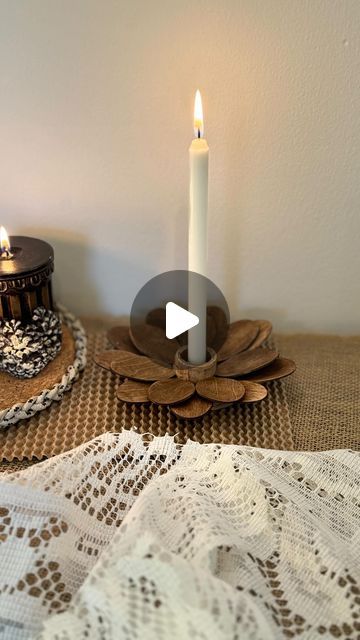 Asma Wali on Instagram: "Making candle holder using disposable wooden spoons ✨ 💫There is nothing better than stumbling upon random items  at dollar shop and realizing it could be such a great project. I stained spoons with coffee mixture. In my top pinned project I explained it in detail. You can check highlights for more details. I made a round base from popsicle sticks, cut spoons and glued them on base. In center I used wooden candle holder. You can use metal lids for base as a substitute and any perfume lid for candle holder. I covered the base with cotton twine to cover the edges. How sweet it looks! You can add any stain you like. You can also add gold leafing.   #festivedecor #homedecor #candleholder #dollartree #craftideas #diyideas #dollarstorediy #homedecorinspo #homedecoration Diy Candle Holders Ideas, Wood Wall Candle Holders, Making Candle Holders, Candle Holder Crafts, Diy Wood Wall, Making Candle, Gold Leafing, Wooden Candle Holder, Eco Friendly Candles