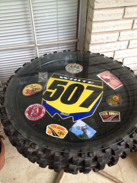 Top of dirt bike table Dirt Bike Tire Ideas, Dirt Bike Decals, Dirt Bike Tire Shelf, Dirt Bike Room Ideas, Dirtbike Room Ideas, Dirt Bike Room Decor, Dirt Bike Garage, Motocross Bedroom Decor, Motocross Room