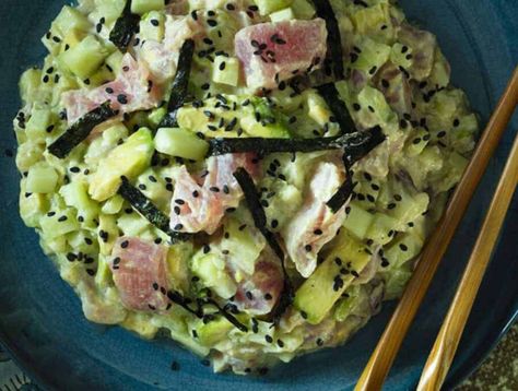 A partial shot of a dark blue plate is a mound of tuna and cucumber sushi. To the right are two wooden chopsticks Keto Tuna Recipes, Tuna Sushi Bowl, Spicy Tuna Sushi, Keto Sushi, Keto Tuna Salad, Spicy Tuna Salad, Low Carb Sushi, Cooked Shrimp Recipes, Keto Tuna