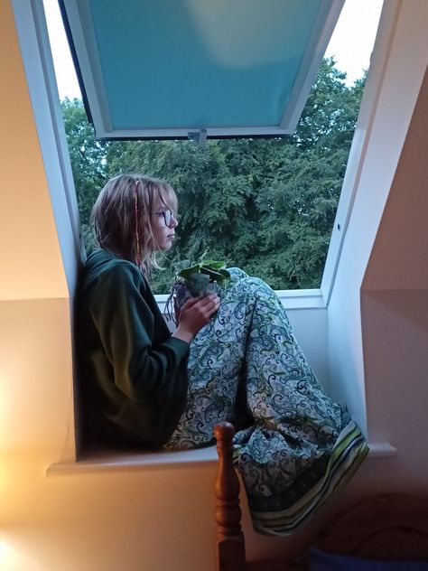 Evening , night , plants , rain , pyjamas , sleepover , aesthetic Sitting By Window, Sitting By A Window, Person Sitting In Window, Person Sitting On Window Sill, Sitting On Window Sill, Sitting By The Window, Sitting Aesthetic, Sitting On Ledge Pose, Person Sitting Reference