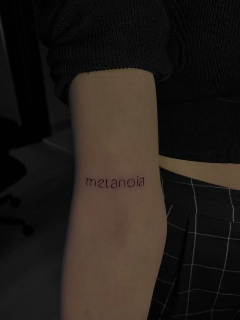 Tattoo metanoia, black and white arm tattoo Metanoia Aesthetic, Psychotic Wallpaper, Healing Process Tattoo, Psychology Tattoo Minimalist, Text Tattoo Arm, Psychology Tattoo, Healing Symbol, Rebirth Tattoo, Tattoo Text