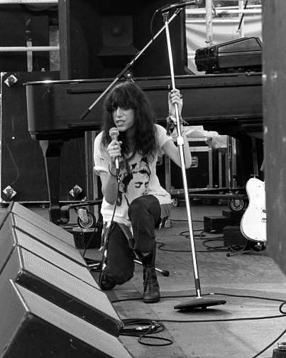 Patti Smith performs live on stage with The Patti Smith Group in Central Park as part of The Dr Pepper Music Festival on August 4, 1978. Photo by Richard E. Aaron. Patti Smith Group, Proto Punk, Performing On Stage, Joe Strummer, Band Photography, Women Of Rock, Patti Smith, Punk Rocker, Youth Culture