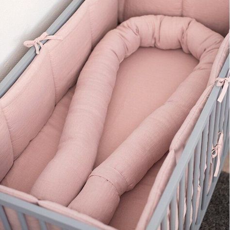 These crib bumpers are available in different colors, and they are filled with paddings, and the outer is made from highest quality, soft and cozy 100% linen fabric. The baby nursery crib bumpers are designed and decorated with ties to add the additional charm. #cribbumper #nursery #nurserydecor #cotdecor #babysafety Crib Bumper Pads, Crib Bumper Ideas, Crib Bumpers, Crib Bumper Tutorial, Wooden Clothes Rack, Oval Crib, Snake Pillow, Baby Cot Bumper, Nordic Nursery