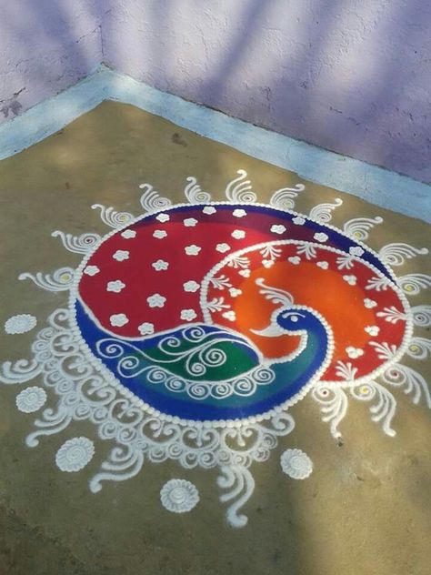 Peacock rangoli                                                                                                                                                                                 More Rangoli On Rough Surface, Big Rangoli Designs Latest, Roopchaudas Rangoli, Rangoli Pictures, Galicha Rangoli Designs, Rangoli Designs Latest Unique, Rangoli Peacock, Birds Rangoli, Sanskar Bharti Rangoli Designs