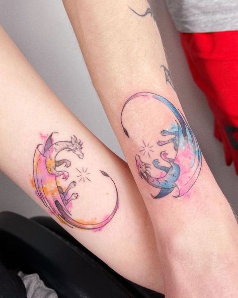 Matching watercolor dragon tattoos by @_tosz- best dragon tattoos for women and girls Amazonian Tattoo, Watercolor Dragon Tattoo, Tattoos For Childrens Names, Cute Dragon Tattoo, Elegant Dragon, Dragon Thigh Tattoo, Black Dragon Tattoo, Wrist Tattoos Girls, Maching Tattoos