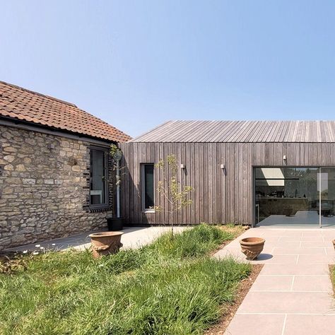 Mitchell Eley Gould turned an existing long low house-in-a-barn into a bedroom wing while a larch-clad extension created a new kitchen and living area Clad Extension, Barn Extension, Barn Conversion Exterior, Porch Extension, Larch Cladding, Outside Room, Agricultural Buildings, Room Extensions, Wooden Barn