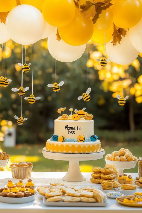 Planning a cute baby sprinkle this September? This 'Mama to Bee' outdoor fall theme is buzzing with charm, perfect for celebrating its a boy! The adorable bee backdrop and sweet decorations, including bee-inspired cake and treats, make this party idea perfect for guests or as a Co-Ed Baby Shower Idea. Whether you’re hosting for mom or welcoming twin boys, this dessert table with bee-themed cupcakes and centerpieces is sure to have everyone falling in love with your baby shower Bee Baby Shower Theme Decoration, Bee Backdrop, Baby Shower For Boys, Bee Baby Shower Cake, Fall Baby Shower Ideas, Baby Shower Themes For Boys, Bee Themed Gender Reveal, Bee Baby Shower Decoration, Twin Boys Baby Shower